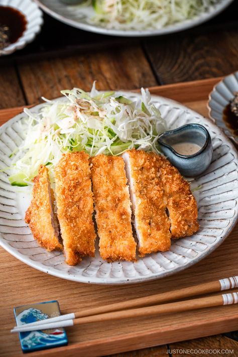 Crispy on the outside and juicy on the inside, this homemade Tonkatsu (Japanese Pork Cutlet) is my family‘s favorite! I‘ll share my secret for a light, airy, and supercrisp crust. Serve it with my tangy and irresistible sesame dipping sauce for an extra savory touch. Japanese Tonkatsu, Japanese Pork Cutlet, Sesame Dipping Sauce, Pork Cutlet Recipes, Pork Cutlet, Tonkatsu Sauce, Japanese Grocery, Easy Japanese Recipes, Pork Cutlets