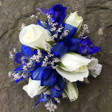 Prom Flowers Corsage Royal Blue, Royal Blue Homecoming Flowers, Corsage With Blue Dress, Royal Blue Prom Flowers Wrist Corsage, Prom Wrist Corsage Ideas Royal Blue, Royal Blue Prom Accessories, Royal Blue Corsage And Boutonniere Prom, Homecoming Flowers Bouquet Blue, Royal Blue And White Corsage