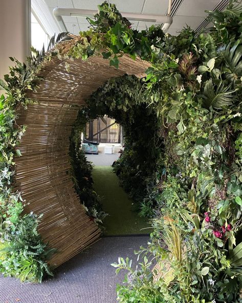 Step through our Jungle Themed Entrance Tunnel, featuring rainforest leaves, vibrant neon lights and tropical flowers 🌴🌺🌿 Transform your event into a tropical paradise with foliage & floral decor that is Fire Retardant, Sustainable, UK Made & Life Like! #floraldesign #foliage #eventdecor #foliagedesign #eventstyling #corporateeventdecor #corporateeventstyling #eventinspiration Floral Tunnel, Jungle Entrance, Jungle Event Decor, Rainforest Decorations, Jungle Theme Decorations, Event Layout, Event Entrance, Jungle Decorations, Rainforest Theme