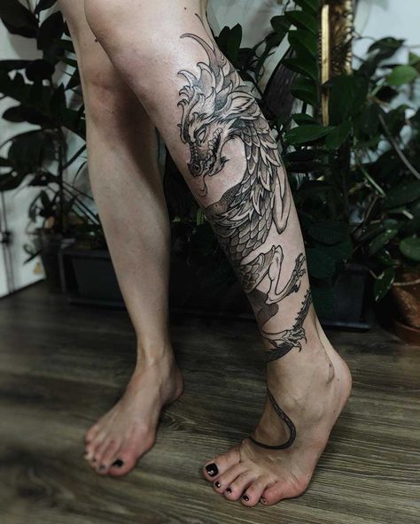 Cool dragon tattoo wrapped around the left calf Dragon Tattoo Calf, Dragon Tattoo Wrapped Around Arm, Dragon Tattoo Leg, Dragon Thigh Tattoo, Tattoo Calf, Tattoo Pierna, Wrap Around Tattoo, Shin Tattoo, Wrap Tattoo