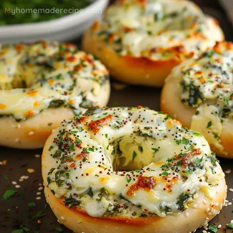 A tasty and easy-to-make bagel recipe featuring a cheesy spinach and artichoke topping. Spinach Artichoke Bagels, Cheesy Spinach Artichoke Bagels, Recipes Using Bagels, Creative Cooking Ideas, Bagel Dinner Ideas, Csid Recipes, Bagel Ideas, Bagel Recipes, Bagel Sandwiches