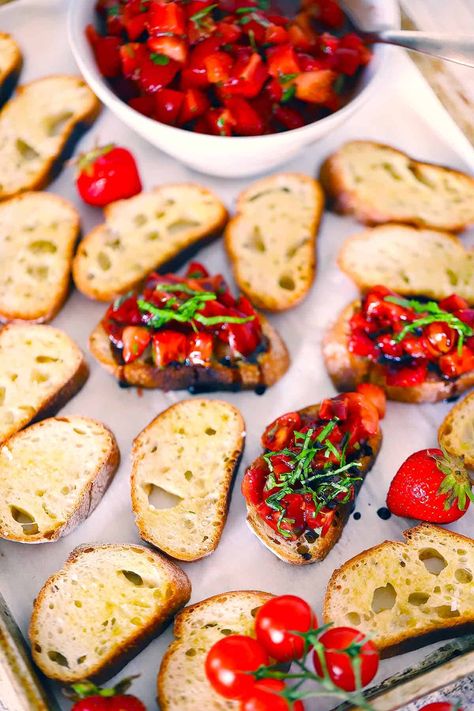 Strawberry Bruschetta with Tomatoes, Basil, and Balsamic served on homemade garlic-rubbed crostini is a simple, easy, fresh appetizer recipe perfect for spring or summer! Vegan, vegetarian, plant-based, and you can serve it on grilled chicken for a grain-free, gluten free, lower carb option to make it a main dish. Strawberry bruschetta is a great make ahead appetizer recipe to take to potlucks or picnics. Strawberry Appetizer Recipes, Strawberry Bruschetta Appetizers, Crustini Appetizers Spring, Summer Appetizers For Party Easy, Strawberry Bruchetta, Summer Appetizers For Party, Strawberry Appetizers, Bruchetta Appetizers, Strawberry Bruschetta