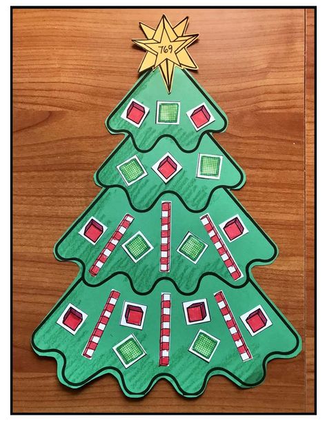 Place Value Activities: Math Activities: Make a Place Value Christmas tree. The ornaments, trunks & gifts are ones, tens & hundreds pieces. There are 13 tree patterns to choose from. What a fun way to practice place value. Completed projects make an adorable December bulletin board too. (A 10s rod looks like a peppermint stick & practices an ABAB (red-white) color pattern too. ) Christmas Place Value 2nd Grade, Christmas Math Craft, Place Value Craft, Math Art Activities, Representing Numbers, December Bulletin Boards, Brunette Hair Color Ideas, Math Art Projects, Apple Kindergarten