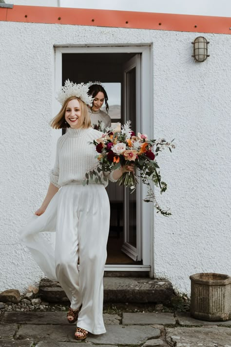 Bride wears House of Ollichon jumpsuit + wool jumper. Caro Weiss Photography Jumper And Skirt Wedding Dress, Wedding Skirt And Sweater, White Sweater Wedding Dress, Winter Bride Outfits, Wedding Jumper, White Jumpsuit Wedding Modest, Casual Bridal Outfit, White Bridal Jumpsuit Long Sleeve, Cream Jumper Dress