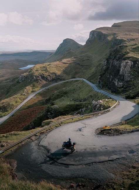 A solo motorbike rides the winding bends of the road leading up to the Quiraing on the Isle of Skye in the Scottish highlands. The iconic green hills of the Trotternash ridge rise from the road. Bike Photography, Album Ideas, Sloped Garden, Road Adventure, Motorcycle Travel, Scotland Highlands, Automotive Photography, Adventure Photography, Road Trippin