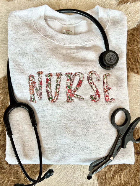 You will absolutely LOVE this fun sweatshirt for your favorite nurse or medical worker! This beautifully embroidered appliqué sweatshirt will keep you cozy, warm, and stylish for all of your busy shifts!💛 Sweatshirt Applique, Appliqué Sweatshirt, Embroidery Crewneck, Applique Sweatshirt, Operating Room, Labor And Delivery, Nurse Christmas, Nurse Sweatshirt, Fun Sweatshirts