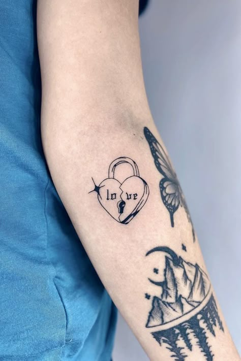 Bad At Love Tattoo, Unique Heart Tattoo Designs, Retro Heart Tattoo, Tattoos For Brokenhearted, Love Lock Tattoo, Edgy Heart Tattoo, Heart Themed Tattoos, Protect Your Heart Tattoo, Melting Heart Tattoo