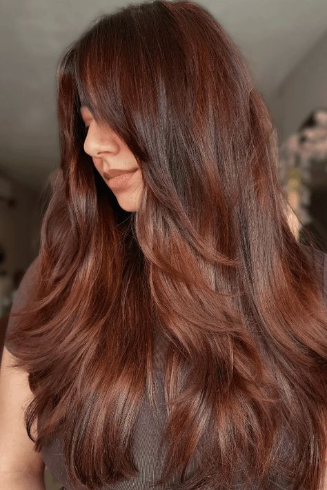 radiant copper, brunette hair, stunning glow Coppery Brown Hair, Copper Brunette Hair, Brunette Hair Shades, Copper Brunette, Voluminous Layers, Warm Brown Hair, Copper Highlights, Tousled Waves, Brunette Color