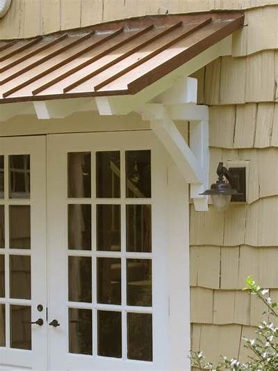 Standing seam metal roof with rafters and brackets. | House exterior, Porch roof, Door overhang Standing Seam Metal Roof Porch, Back Door Overhang Ideas, Wood Awning Over Door Front Door, Front Porch With Metal Roof, Side Door Awning, Door Overhang Ideas, House Exterior Porch, Awning Over Door, Door Overhang