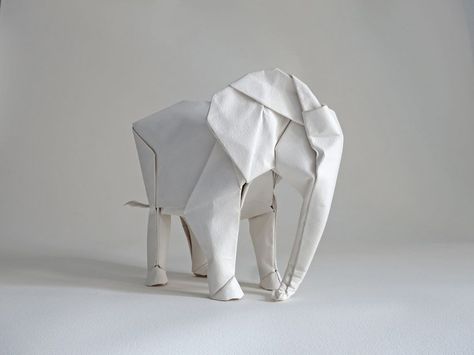 Making a Life-Size Origami Elephant, by Swiss artist  Sipho Mabona. He developed the pattern for the elephant in about a month, a process that was sped up by having already worked out how to make patterns for origami tigers, bears, and rhinos. Origami Návody, Origami Tiger, Origami Day, Origami Elephant, Tutorial Origami, Origami Artist, Origami And Kirigami, Origami Paper Art, Money Origami