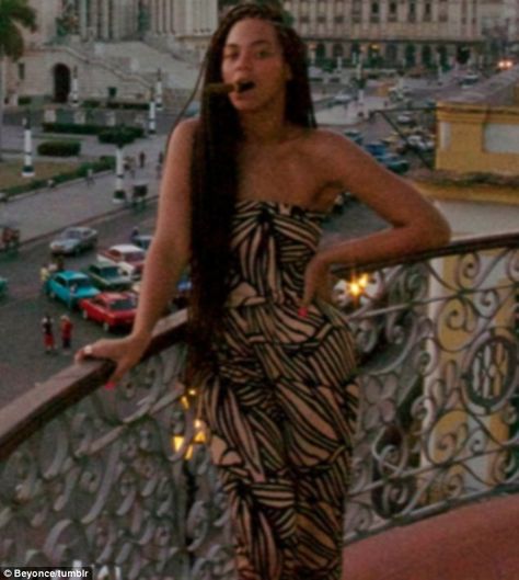 Smoking: In one of the images the star has a cigar between her teeth as she poses on her hotel balcony Beyonce 2000's, Women Cigars, Director's Chair, Queen Bee Beyonce, Cigars And Women, Dark Brunette Hair, Women And Cigars, Sweet Photo, Beyonce Style