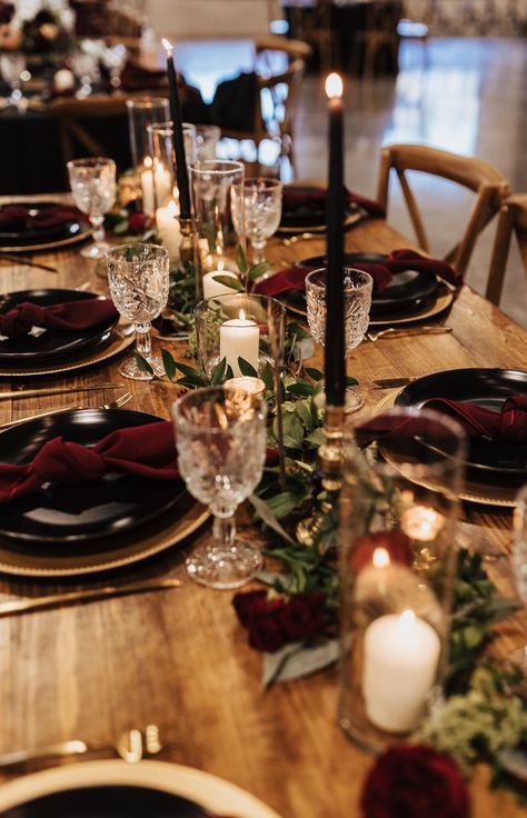 Black plates, gold chargers, cut crystal glassware, moody black candles juxtaposed on rustic farm tables for a moody romantic table setting at Sarah and Trevor's wedding reception. Black Burgundy And Gold Wedding, Burgundy Winter Wedding, Christmas Dinner Table Decorations, Gold Charger Plates, Burgundy And Gold Wedding, Dinner Table Decorations, Winter Wedding Reception, Dark Romantic Wedding, Charger Plates Wedding