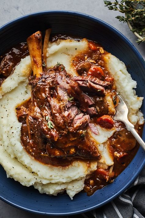 These Beer Braised Lamb Shank are fall-off the bone tender, slowly braised with fresh herbs and garlic Best Lamb Shank Recipe, Braised Lamb Shanks Recipe, Braised Lamb Shank, Tandoori Lamb, Sunday Roasts, Lamb Shank Recipe, Guyanese Recipes, Braised Lamb Shanks, Lamb Shank