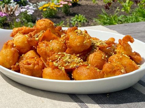 Greek Donuts with Honey Recipe | Michael Symon | Food Network Greek Donuts, Michael Symon, Michael Simon, Greek Dishes, Honey Syrup, Honey Recipes, Greek Food, Honey And Cinnamon, Again And Again