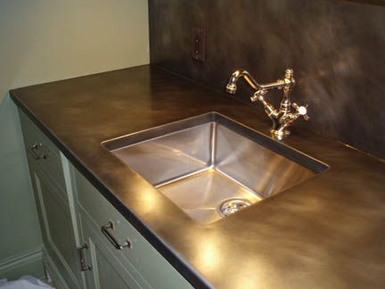 Patinated bronze countertop with undermount sink. Stainless Countertops, Copper Countertops, Zinc Countertops, Metal Countertops, Steel Countertops, Steel Countertop, Kitchen Hood, Countertop Options, Custom Countertops