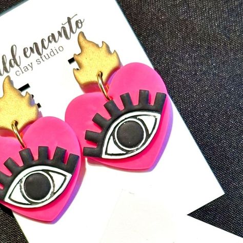 Wild Encanto on Instagram: "🧿❤️ Protect your heart with our stunning Evil Eye Heart Earrings! Handcrafted from lightweight polymer clay in vibrant colors, these earrings are the perfect accessory to add a pop of color to any outfit. Get yours today and ward off negativity with style! 🩷🧿  #EvilEyeEarrings  #WildEncanto  #HandcraftedJewelry  #ShopLocal" Protect Your Heart, Evil Eye Earrings, Pop Of Color, Heart Earrings, Evil Eye, Handcrafted Jewelry, Color Pop, Polymer Clay, Vibrant Colors