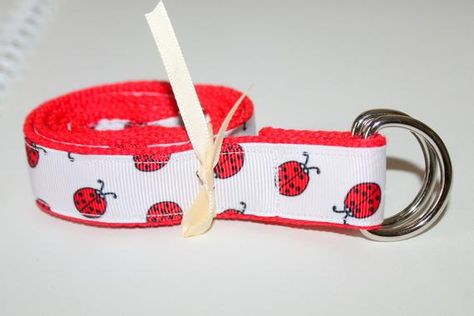 Custom made ribbon belts perfect for kids of all sizes. This belt can be worn over clothes or just to hold up those summer shorts. Belt has red cotton webbing with ladybugs printed grosgrain ribbon stitched on one side. We added ribbon to the back piece so the ladybugs show when the belt is worn. The belt is very sturdy and stays on even the littlest body. The belt is made fit your child or teen waist plus about 6 inches. Silver D ring buckle makes it easy for kids to make sure their pants stay Cutecore Clothes, Ladybug Birthday Party, Ladybug Birthday, Tan Belt, D Ring Belt, Kids Belt, Girl D, Ring Belt, Back Piece