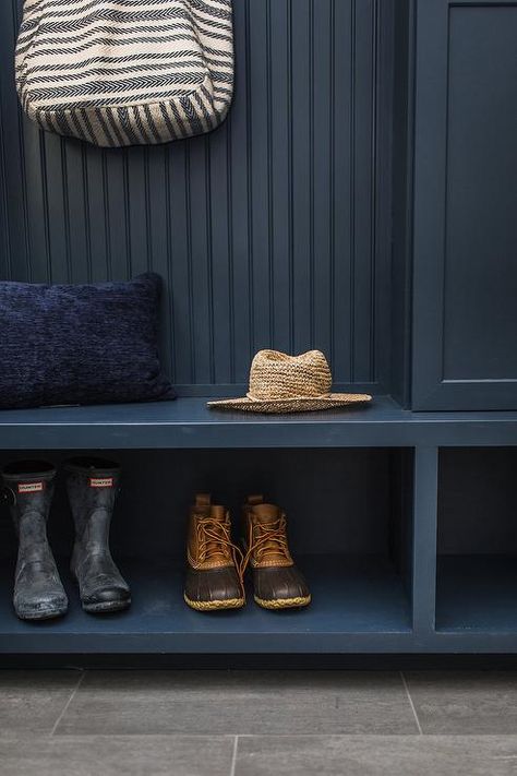 Dark blue mudroom bench, built-ins, and cabinets accented with dark blue beadboard trim in a transitional mudroom completed with gray wood like floor tiles. Dark Blue Mudroom, Doorway Storage, Blue Mudroom, Everyday Goals, Blue Beadboard, Dark Stained Wood Floors, Beadboard Trim, Floating Bench, Aesthetic Plaid