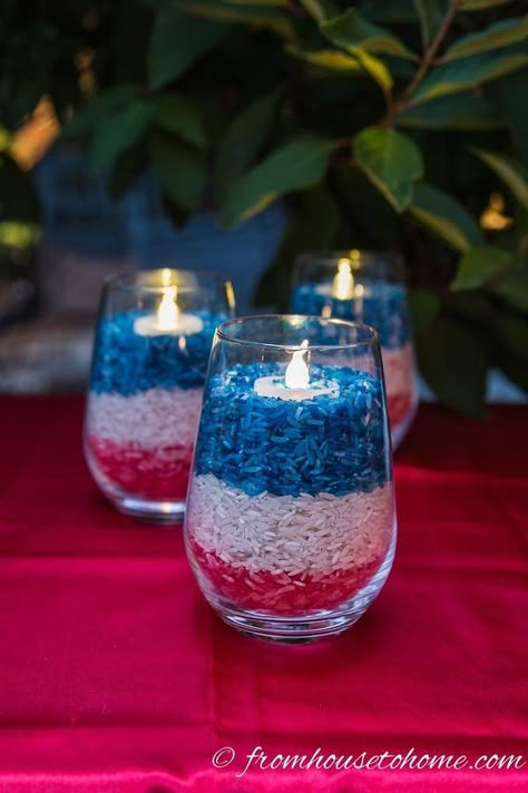 Every year I host a big backyard cook out for the 4th of July. The problem is that I spend so much time cooking for this event that I don't have a lot of time left for decorating. So I'm always looking for really easy ways to add some red, white and blue to my party decor, and these super simple candle holders definitely fit the bill. Click HERE to see all of my 4th of July DIY decor projects. All you need to get started is a tall glass, small vase or mason jar, some white rice, and… Blue Candle Holders, Ranch Resort, Crafting Corner, Blue Candle, Fourth Of July Decorations, July Recipes, 4th July Crafts, 4th Of July Desserts, July Ideas