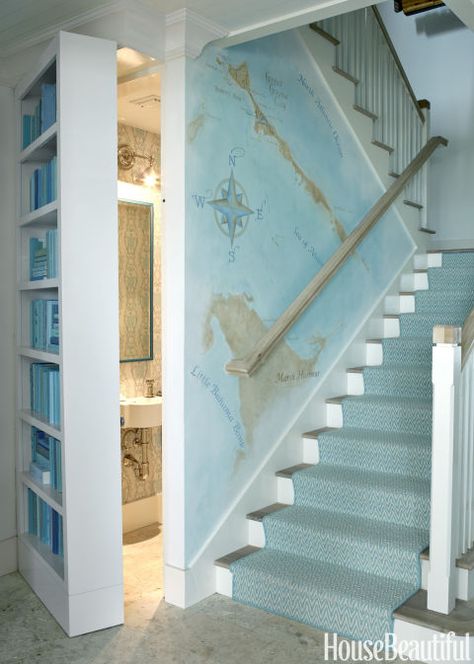 The powder room's swinging door houses a color-coordinated bookcase. Artist Judy Mulligan painted a map of Guana Cay that Watson says includes "the house, the family's favorite bar and places they like to take their boat." Bahamas House, Remodel Diy, Decor Eclectic, House Of Turquoise, Dream Beach Houses, Casa Country, Stair Case, Coastal Living Rooms, Diy Simple