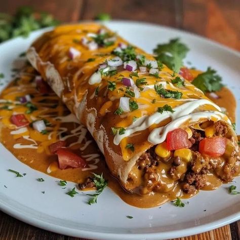 Wet burritos are a beloved comfort food, known for their hearty fillings, rich sauces, and cheesy toppings. They bring together the best elements of traditional Mexican cuisine in a single, indulgent dish. The name “wet” comes from the generous amount of sauce that smothers the … Wet Burrito Recipe Ground Beef, Brisket Burritos, Wet Burrito Recipe, Mini Burritos, Wet Burrito Recipes, Wet Burrito, Chile Peppers, Burritos Recipe, Shredded Lettuce