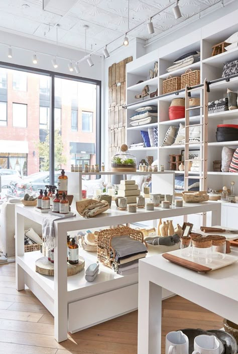 The aesthete behind acclaimed design firm Chango & Co. has launched a boutique filled with everything you need to achieve the modern farmhouse look | archdigest.com Brooklyn Interior, Interior Boutique, Display Visual Merchandising, Store Interiors, White Shelves, Salon Interior Design, Designer Boutique, Boutique Logo, Store Design Interior