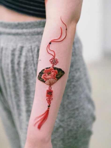 Red peony fan with her grandmother's protection charm #tattoo #norigaetattoo #fantattoo #peonytattoo #colortattoo #flowertattoo #tattooistsion | Aug 23rd 2019 | 1148704 Charm Tattoo, Korean Tattoos, Fan Tattoo, Red Peony, Intricate Tattoo, Fire Tattoo, Delicate Tattoo, Peonies Tattoo, Tattoo Cover