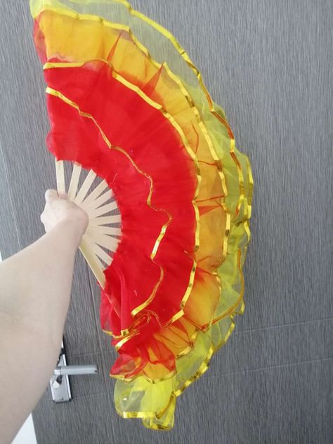 This is a Chinese fan - used as a stage performance, such as dancing, accompaniment or special movie props. It's made of silk and comes in various colors    Factory production, support to customize various sizes of colors and printed logos, our company supports wholesale and retail.  Wechat: ysnlgssy  whatsapp:13911045129  E-mail: mochilapang@outlook.com Chinese Fan, Stage Props, Solo Performance, Stage Performance, Movie Props, Hand Fan, Red Yellow, Dancing, Fan