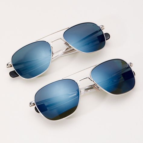 The Aviator, our top-selling icon style, in 23k White Gold with premium polarized Cobalt blue mirrored glass lenses. Now available in XL. Details include titanium nose pads and black tipped temples with 1973 logo. Engineered to military specs, designed and handcrafted in the USA.