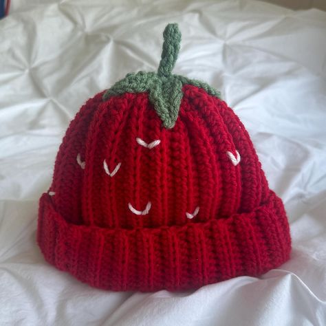 This Handmade Crochet Strawberry Beanie is the perfect blend of cozy and cute, designed to keep you warm while showing off your love for all things strawberry! Featuring a 3D crochet stem on top and a vibrant red beanie, it's the ultimate accessory for strawberry lovers or anyone who enjoys a fun, whimsical look. The stretchy, soft knit ensures a comfortable fit for all sizes, making it ideal for chilly winter days or as a cute spring accessory. With its playful strawberry shortcake vibes, this beanie makes a great gift for fruit lovers, fashion-forward friends, or anyone who appreciates a creative, handmade touch. Whether you're rocking it on a cold day or just want to add some berry sweetness to your outfit, this hat is sure to stand out! Free shipping on all my items and bundle to get m Strawberry Beanie, Fruit Hat, 3d Crochet, Crochet Products, Crochet Strawberry, Red Beanie, Spring Accessories, Strawberry Fruit, Garden Fairy