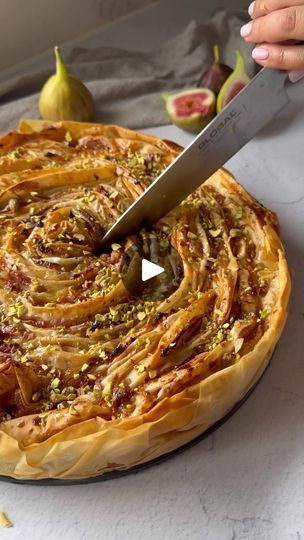 40K views · 1K reactions | FIG SOUFRA. If you love a Fillo Pastry soufra, then you will love this delicious version with seasonal fresh figs. Watch along as the sheets of Fillo Pastry are crinkled and spiralled to form a beautiful spiral. The combination of sweet figs, fig jam, custard, honey and pistachio nuts is amazing! We enjoy eating this warm, straight out of the oven! You’ll find the recipe on the Antoniou Fillo Pastry website, here is the direct link which you can copy into your internet browser:  https://antonioufillo.com.au/blog/recipes/fig-soufra  Recipe and video: Mary’s Kouzina . SYD  for Antoniou Fillo Pastry | Antoniou Fillo Pastry | Billy Esteban · Greek Poem Soufra Recipes, Fillo Dough Recipes Savory, Fillo Dough Recipes Dessert, Fillo Pastry Recipes, Filo Pastry Apple Pie, Filo Dough Apple Recipes, Fig And Brie Fillo Crinkle Pie, Moroccan Desserts, Fig Tart