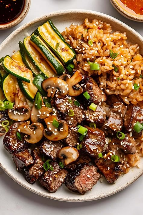 Bring the Japanese steakhouse into your home with this hibachi steak recipe! The savory-sweet sauce is over the top, and your family will devour every last bite! Dinner With Steak Meat, Crockpot Hibachi Steak, Steak Asparagus Mushroom Stir Fry, Easy Recipes With Steak, Steak Pan Recipes, Steak Bites Over Rice, Steak Teriyaki Bowl, Steak Power Bowls, Winter Steak Recipes