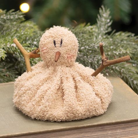 Our Baby Melting Snowman is made of textured fabric that is filled for a beanbag-style effect. This short, slouchy snowman has a wooden nose, rustic twig arms, and rosy cheeks. Perfect for adding a playful touch to a tabletop display of Winter decor. Measures 4" tall and 4" in diameter. Primitive Christmas Crafts, Snowman Baby, Melting Snowman, Tabletop Shelf, Melting Snowmen, Christmas Crafts Diy Projects, Wood Snowman, Natural Christmas Decor, Primitive Snowmen