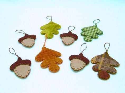 Autumn Felt Ornaments. I like the patterns used for the leaves Autumn Ornaments, Felt Acorn, Thanksgiving Ornaments, Acorn Design, Acorn Decorations, Fall Ornaments, Felted Acorns, Acorn Ornaments, Felted Wool Crafts