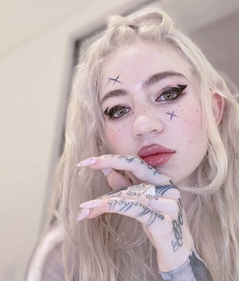 Grimes has tattooed ‘painful, beautiful alien scars’ across her whole back | Dazed Beauty Grimes Tattoo, Grime Tattoo, Ethereal Goddess, White Ink Tattoo, Face Tattoos, Fine Art Jewelry, Aesthetic Tattoo, Pearl Jewellery Earrings, Evil Eye Jewelry