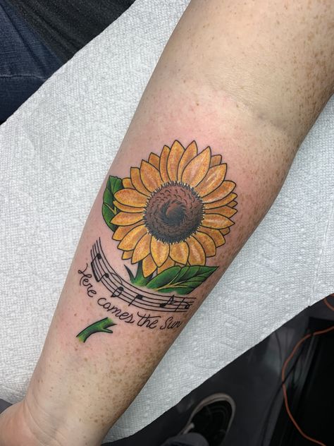 Sunflower tattoo with music and lyrics to Here Comes the Sun. Sunflower And Music Tattoo, Sunflower Music Tattoo, Here Comes The Sun Tattoo, Dad Memorial Tattoo, Sunflower Tattoo Thigh, Sunflower Tattoo Sleeve, Arm Sleeve Tattoos For Women, Music Notes Tattoo, Tattoo Placements