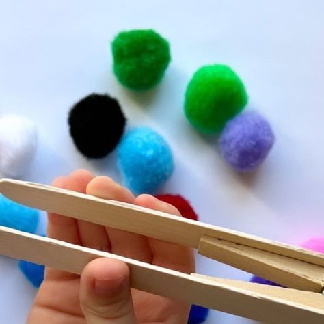 Rozanne | Bright Little Brains on Instagram: "Tongs/Tweezers are so versatile when it comes to toddler/preschool activities. It’s a great tool to have (either store brought or an easy DIY one) doesn’t matter, it’s a tool used to develop some important skills for development. Materials you need to make these DIY craft stick tongs: ⭐️ popsicle sticks (2) ⭐️ a clothepin (1) ⭐️ hot glue gun Let your little one decorate the tongs for another fun activity idea! Tongs/Tweezers are used to eith Tweezer Activities For Preschool, Fine Motor Clothespin Activities, Tweezer Games Fine Motor, Fine Motor Tong Activities, Toddler Preschool Activities, Painters Tape Toddler Activities, Hand Muscles, Preschool Activities Toddler, Old Room