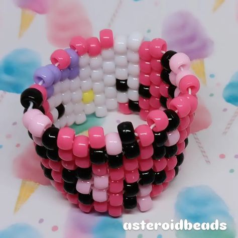 hello kitty leopard kandi cuff :3 🫧🫧🫧 ♡ check out my page for tons of other kandi + jewelry content >:3 ♡ handmade with love by me! ♡ i follow back fellow kandi makers / jewelry small businesses! 🫧🫧🫧 shares are greatly appreciated! you are helping me grow my small business <3 PLUR!! 🫶🌈 #kandi #smallbusiness #smallbiz #kandibusiness #scenekid #kidcore #fairykei #decorakei #dreamcore #nostalgiacore #kawaii #hellokitty #sanrio Sanrio Kandi, Kandi Jewelry, Hello Kitty Leopard, Jewelry Content, Kawaii Hellokitty, Kandi Inspo, I Follow Back, Nostalgia Core, Kandi Cuff