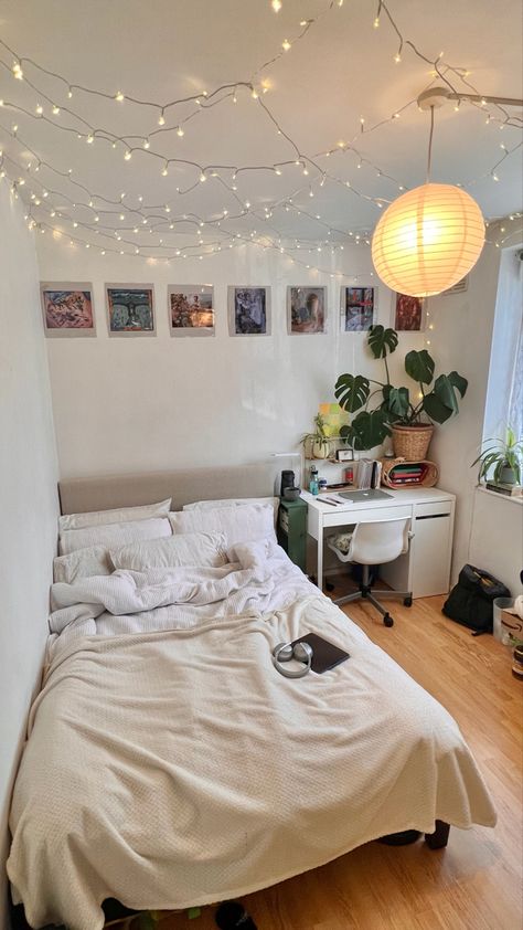 my little cosy uni house bedroom - decorated with plante, cushions, blankets, a paper lampshade, fairylights & love🫶🏽🫶🏽🫶🏽🫶🏽 #room #roomdecor #decor #roomideas #bedroominspo #inspo #neutraldecor Off White Bedding, Wall Art Plants, Uni House, Uni Bedroom, Plants Poster, Plants Wall Art, Cozy Small Bedrooms, Dorm Room Wall Art, Art Plants