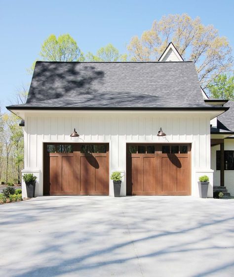 Farmhouse Garage Door Ideas and Inspiration | Hunker Brown Garage Door, Plank And Pillow, Carriage House Garage Doors, Garage Door House, Board And Batten Exterior, Carriage House Garage, Steel Garage Doors, Farmhouse Garage, Garage Door Styles