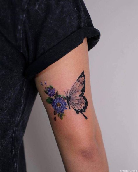 Aster Flower Upperarm Tattoo patricktattoo1613 Butterfly With Aster Flower Tattoo, Purple Butterfly Tattoo With Flowers, Aster Butterfly Tattoo, Crysanthemum Tattoo Butterfly, Larkspur Butterfly Tattoo, Purple Aster Tattoo, Larkspur And Butterfly Tattoo, Birth Butterfly Tattoo, Aster Flower Tattoo September