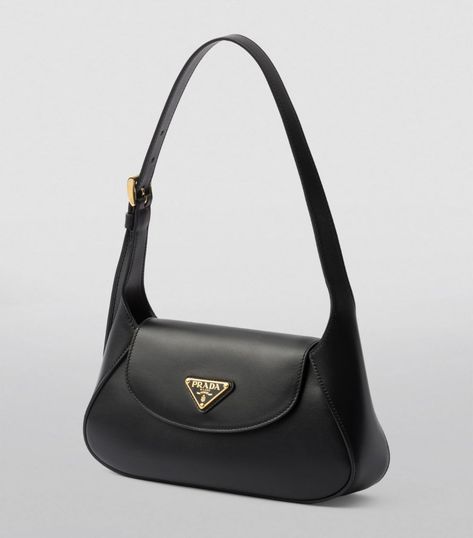 A refined example of timeless leatherwork, this shoulder bag by Prada merges a sleek silhouette with supple leather. Topped with the House’s Triangle motif and offering a choice between being carried by hand or worn over the shoulder, this piece is an evergreen creation with distinctive day-to-night versatility. Prada Black Bag, Black Prada Bag, Prada Handbag, Luxury Bags Collection, Designer Shoulder Bag, Prada Shoulder Bag, Vintage Shoulder Bag, Jewelry Accessories Ideas, Girly Accessories