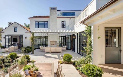 Step into this Newport Beach house with a stunning East coast vibe Newport Beach House, Beach House Tour, Steel Doors And Windows, East Coast Style, Front Courtyard, Cozy Patio, Wood Beam Ceiling, Outdoor Pots, Garden Studio