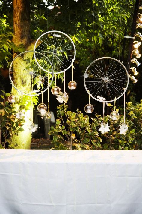 Bike rims with hanging tea lights / Party decorations, Backdrop // ROOT 75 flowers & home - coronado, ca Bike Spoke Decorations Ideas, Cycle Decoration Ideas Wedding, Decorate Bicycle, Wedding Bike Decoration, Cycle Rim Wall Decor, Garden Tools Decor, Lucky Flower, Hanging Tea Lights, Lights Party