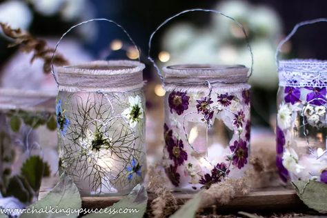 Today I'm sharing how to make magical glass jar lanterns with pressed flowers. These pretty luminaries are perfect for lighting up summer and autumn evenings indoors or out! ﻿If you are looking for DIY party decorating ideas, these glass jar lanterns will make a lovely table decoration. Hang them up outside in the trees as rustic wedding or birthday party decorations. It's an easy craft for adults and children alike. See the how-to VIDEO here. Visit my blog for the full tutorial. (See… Flower Wall Stencil, Plastic Bottle Tops, Flower Projects, Soda Can Art, Sweet Candles, Pressed Flower Crafts, Pink Napkins, Candle Wrap, Jar Lanterns