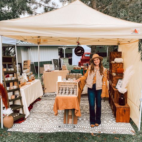 Candle maker with market display Cozy Vendor Booth, Candle Market Display Ideas, How To Make Your Vendor Booth Stand Out, Foldable Pegboard Display, Outdoor Vendor Booth Display Ideas, Candle Vendor Display, Rustic Vendor Booth Display Ideas, Fall Vendor Booth Ideas, Candle Display Craft Show