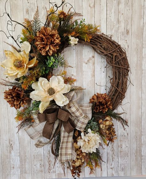 Add charm to your entryway with large gorgeous brown and cream flowers that compliment any decor all year long.  Makes the perfect housewarming gift or for any occasion. Our wreaths are made with high quality florals and ribbons. Measurements are from tip to tip of design. Wreaths For Front Door Everyday, Brown Wreath, Grapevine Wreaths, Boho Grapevine Wreath, Fall Oval Grapevine Wreath Ideas, Cream Colored Christams Wreath Front Doir, Brown Wicker Wreath, Decorated Wreaths, Floral Door Wreaths