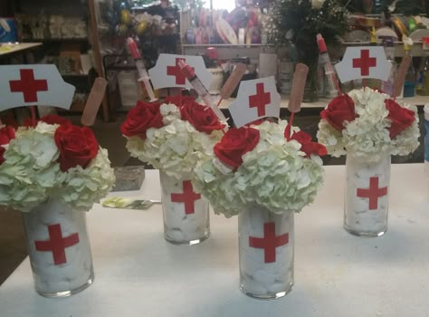 nurses retirement/graduation centerpieces Nurse Retirement Party Centerpieces, Nurse Graduation Centerpiece Ideas, Pinning Ceremony Nurse Decoration, Nursing School Graduation Party Ideas Centerpieces, Nursing Grad Party Centerpieces, Retirement Party Ideas For Nurses, Nurse Centerpieces Table Decorations, Nurse Graduation Party Centerpieces, Nurse Pinning Ceremony Decorations