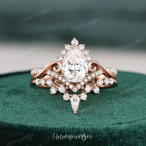 Vine Pear Shape Moissanite Wedding Set Vintage Moissanite Engagement Ring Set Infinity Rose Gold Unique Brilliant Halo Ring Bridal Set Women * Order Service: Engraving/Rush Order/ Shipping Upgrade/ Size Upgrade/ 18K or Platinum upgrade https://www.etsy.com/listing/889751602/ Jewelry Details:  * Center Stone: Moissanite, Color DEF, Pear Shaped  * Measures: 6x8mm, about 1.2ct * Accents Stones: Colorless Moissanite or Natural Diamonds  * about 0.49carats * Natural Diamond: * Color & Clarity: H, SI Moissanite Bridal Set, Vintage Pear Ring, Vintage Teardrop Engagement Ring, Unique Bridal Ring Sets, Unique Moissanite Engagement Rings, Vintage Wedding Sets, Pear Shaped Engagement Rings Rose Gold, Dream Wedding Ring Unique, Unique Vintage Wedding Rings