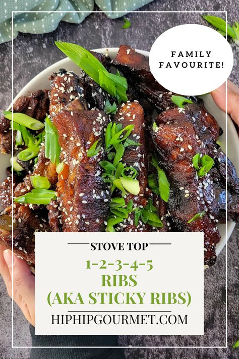 hands holding a bowl of sticky asian ribs garnished with sesame seeds and green onions Chinese Sticky Ribs Recipe, Ribs Asian Style, Sticky Asian Pork, Thai Ribs, Asian Pork Ribs, Sticky Ribs Recipe, Sticky Pork Ribs, Sticky Ribs, Sticky Pork